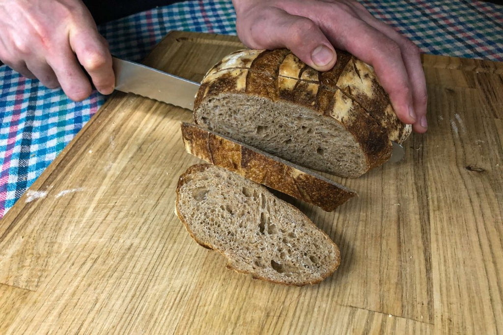 Cutting whole wheat sourdough bread