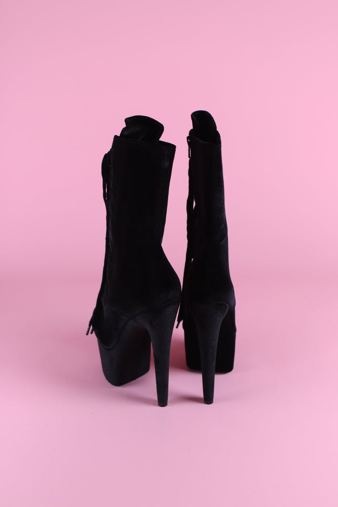 
            
                Load image into Gallery viewer, The black velvet boots are posed away showing the black velvet covered platform and heel.
            
        