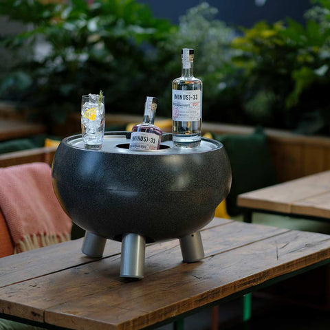 ice bucket with lid keeping drinks cool on garden table