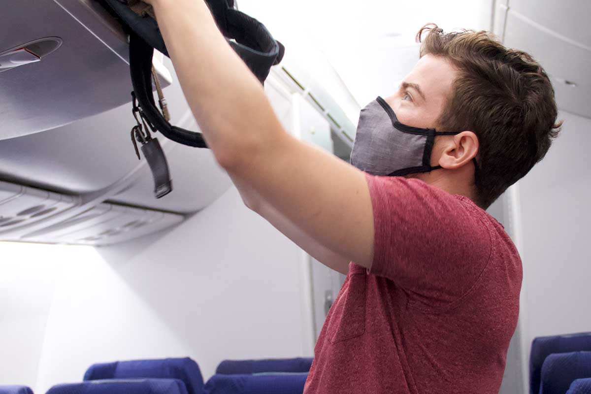 Man wearing the sonomask pro during a flight