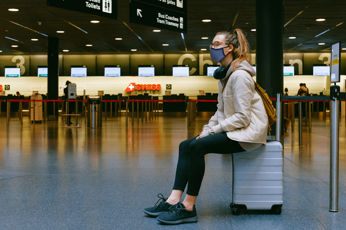 Woman with the SonoMask™ Pro at the airport