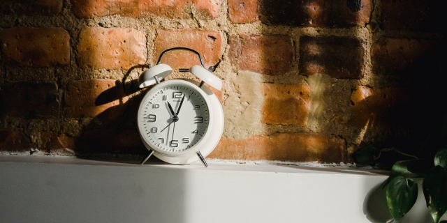 A clock alarm on a table