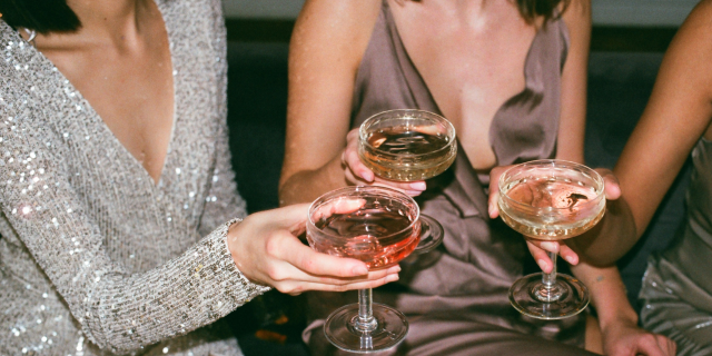 3 women cheering with 3 cups 