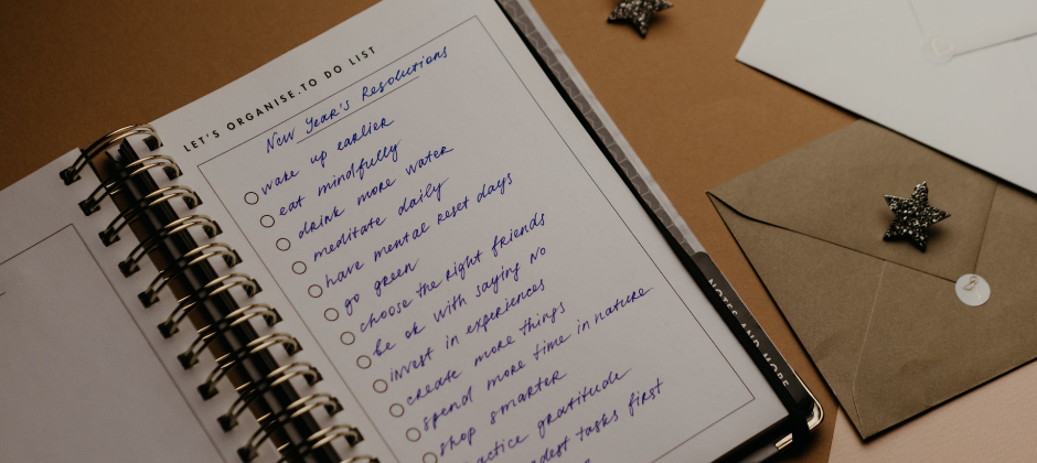 A notebook with a list of new years resolutions