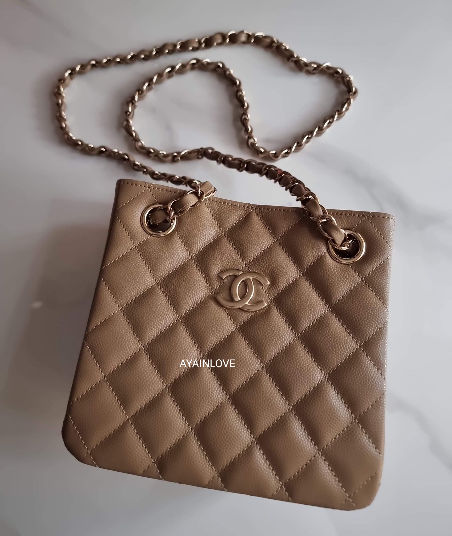 CHANEL 22A Dark Beige Caviar Mini Bucket Bag Light Gold Hardware –  AYAINLOVE CURATED LUXURIES