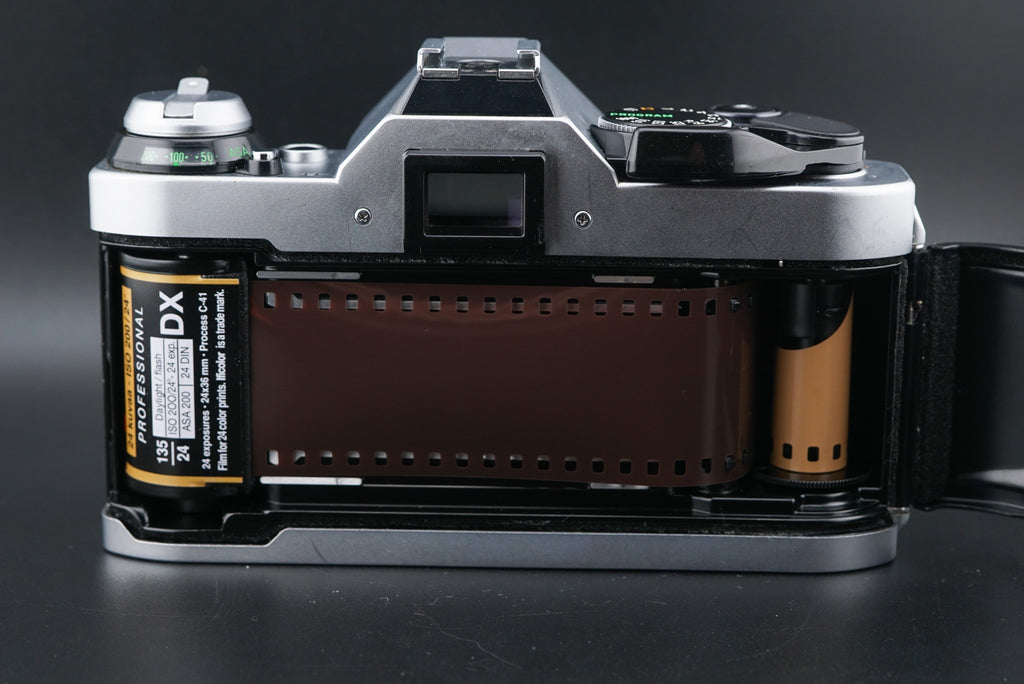 Film inserted properly into Canon AE-1 Program camera