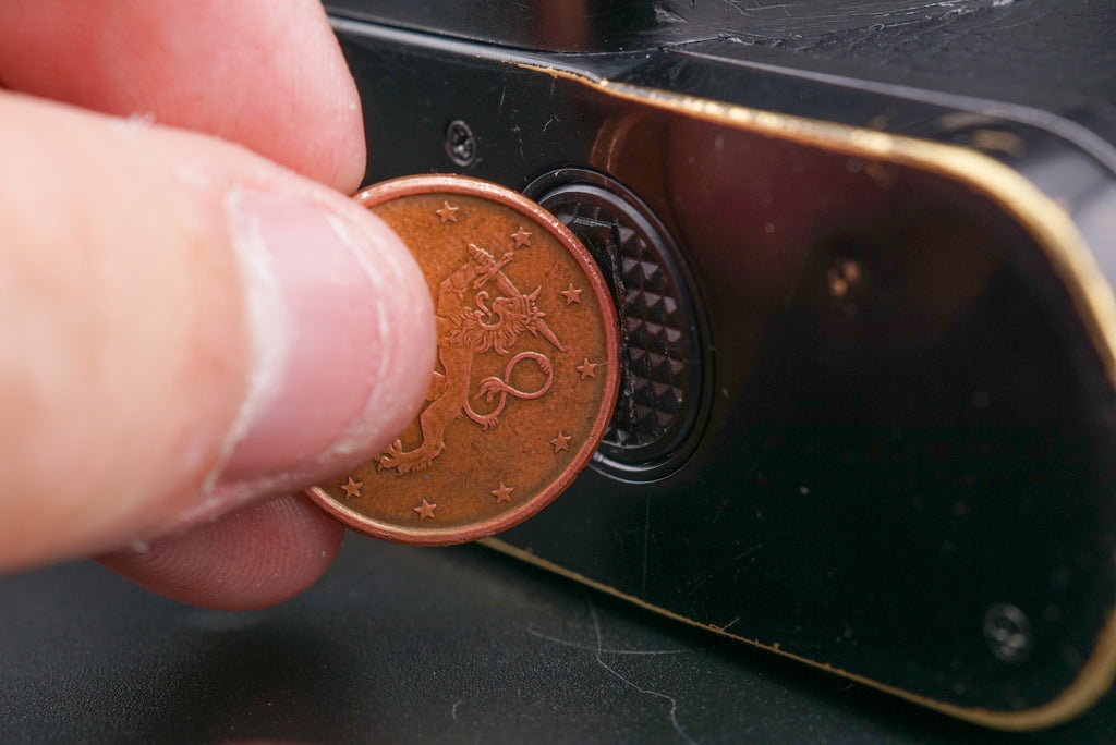 opening the battery cover of a Yashica FX-3