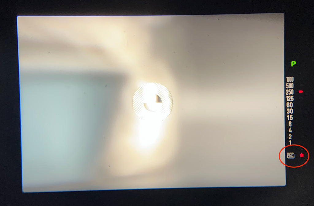 view inside of a viewfinder of a Minolta X-700 film camera