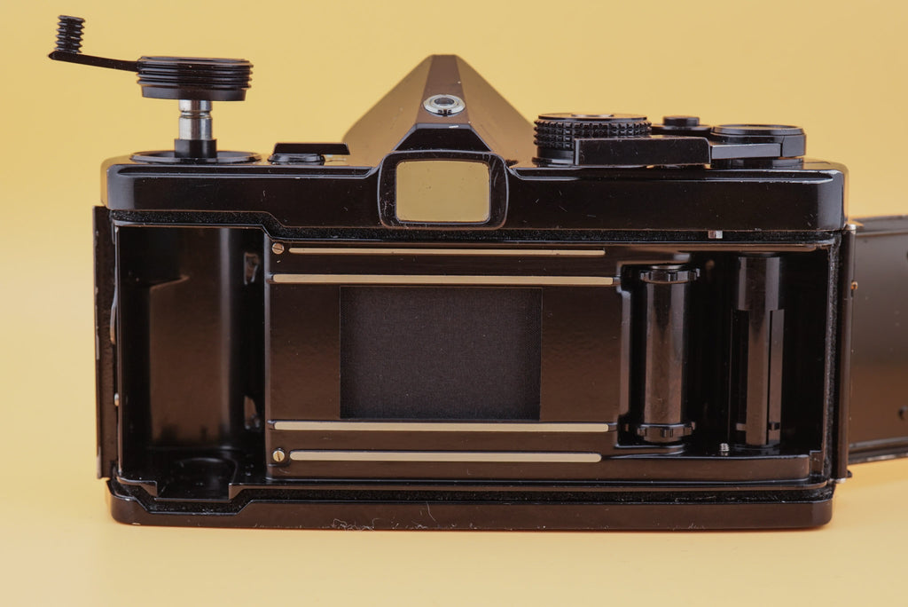 backside of the olympus om-1 camera with film compartment, shutter, advance spool, and take-up spool