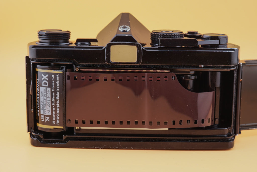 roll of film inside an olympus om-1 camera