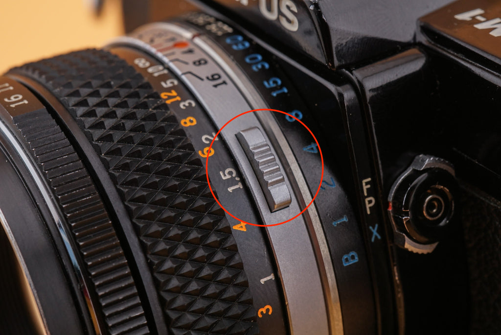 lens release button of an olympus lens