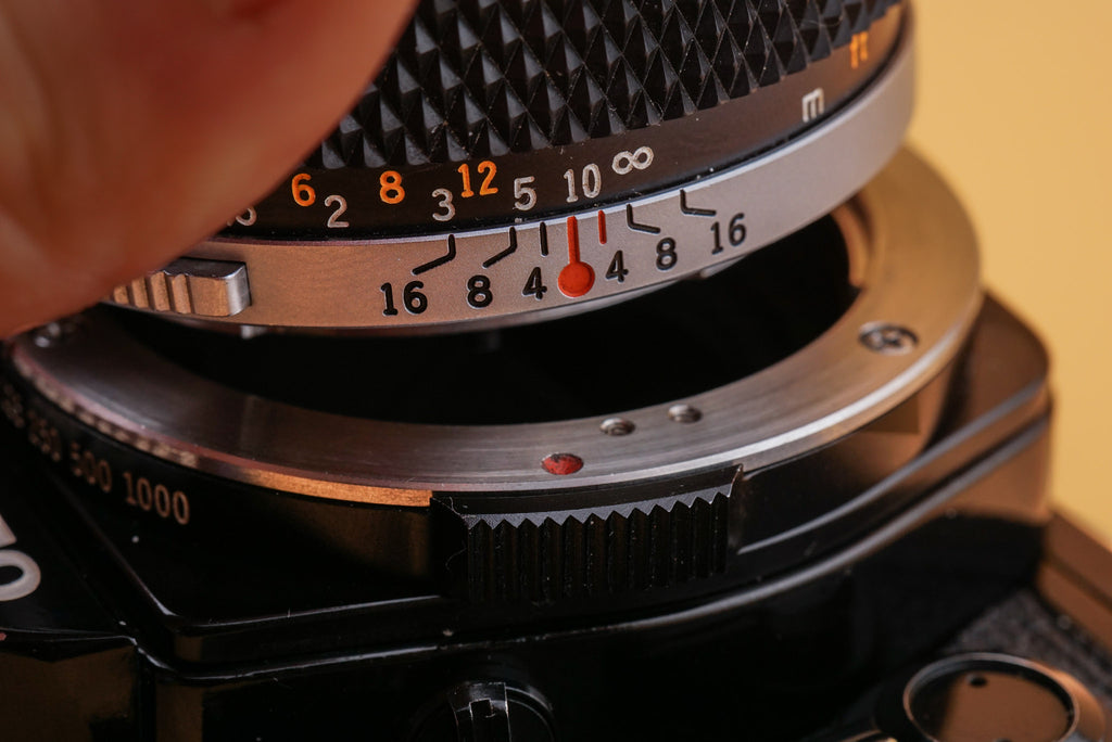 closeup of an olympus om camera lens