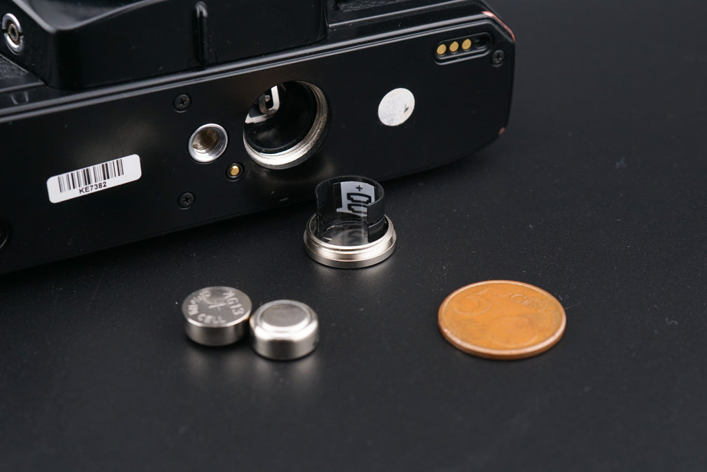 Minolta X-700 film camera battery cover opened