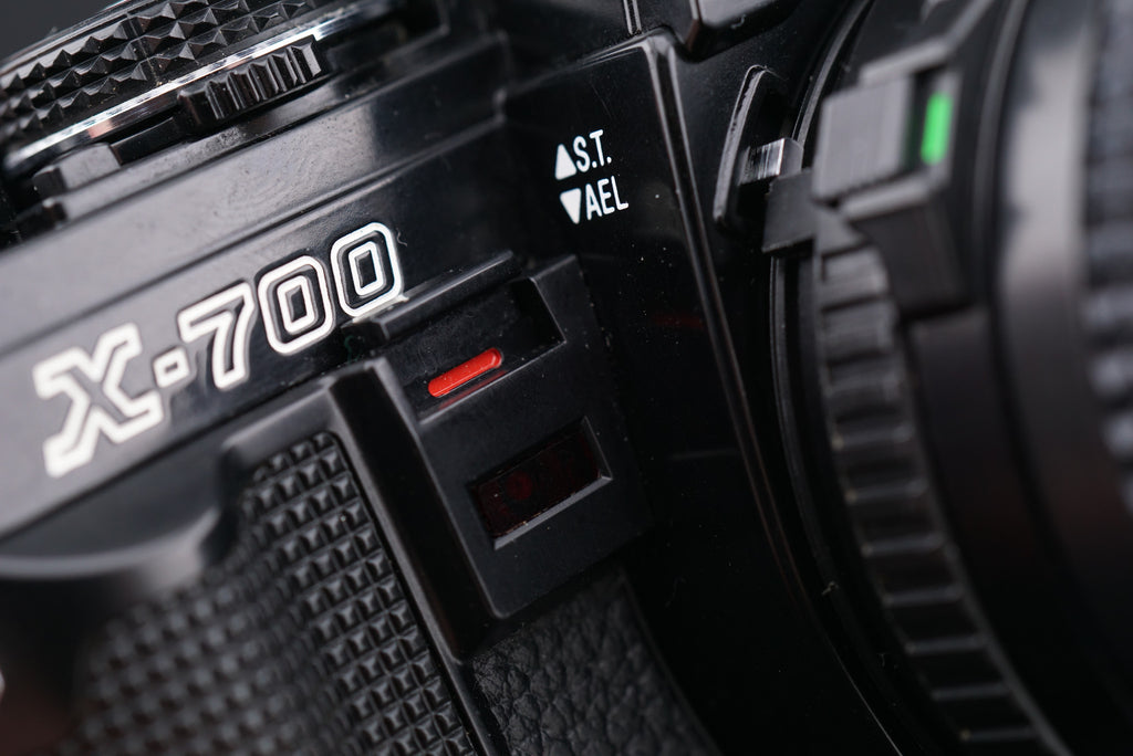close-up of Minolta X-700 film camera Self-Timer and Auto Exposure Lock