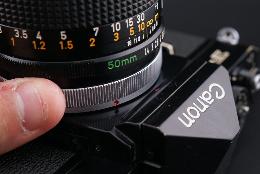 attaching lens to Canon F-1 camera