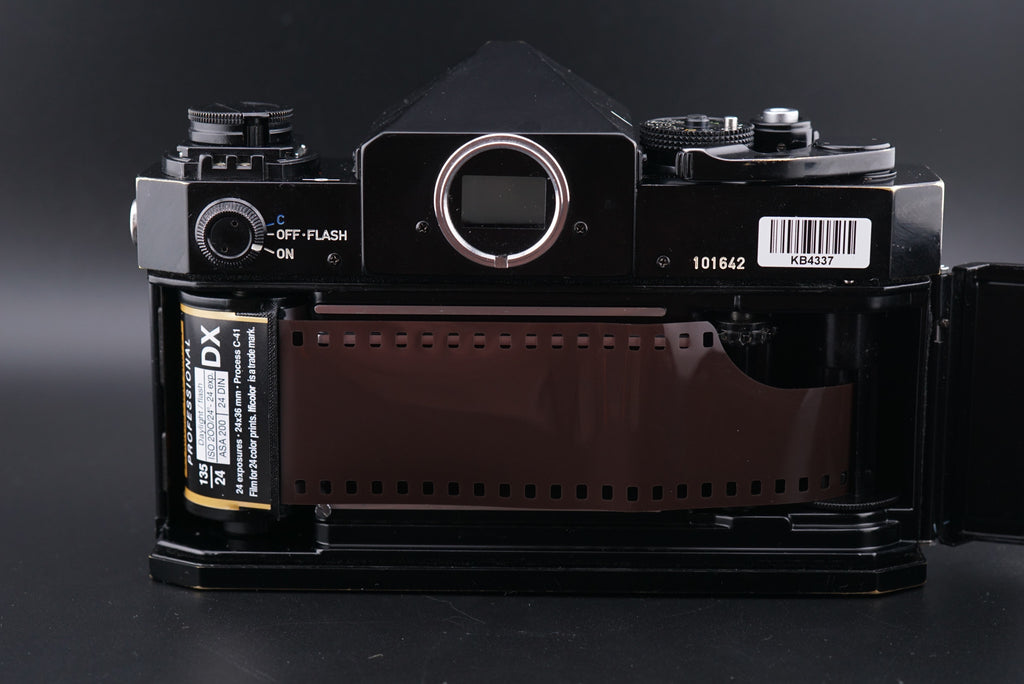 a roll of film inside of a Canon F-1 film camera