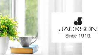 George N Jackson Fabrics logo and image of plant, book, and tea cup in front of window