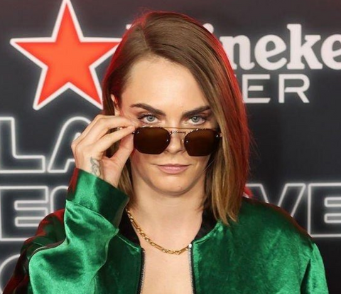 Cara Delevingne wearing sunglasses at the Las Vegas Formula 1 Grand Prix 2023