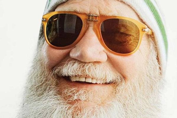 David-Letterman-wearing-large-orange-Persol-sunglasses-and-wool-hat-laughing