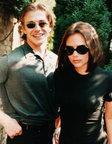 Victoria and David Beckham wearing sunglasses in 1997