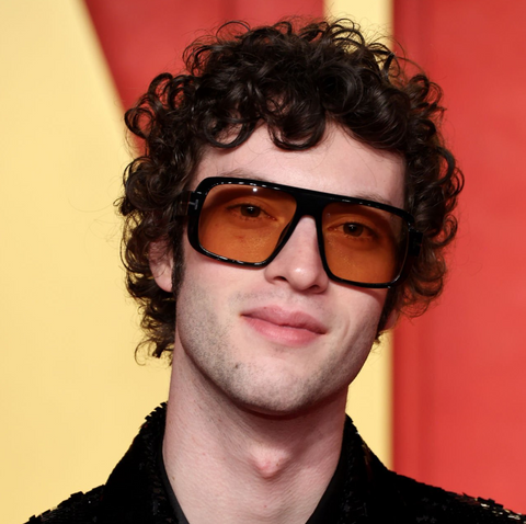 Dominic Sessa at the 96th Oscar Academy Awards wearing Tom Ford sunglasses with orange lenses.