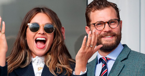 Jamie Dornan at Cheltenham Races wearing Oliver Peoples glasses with Amelia Warner