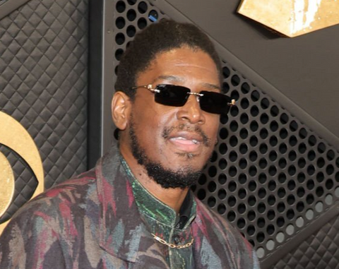 Labrinth on the red carpet at the 66th annual Grammy Awards wearing rectangular Cartier sunglasses