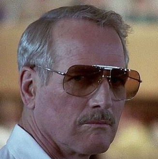 Paul Newman in 'The Color of Money' wearing metal aviator sunglasses.