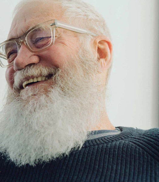 Portarit-of-David-Letterman-with-grey-hair-long-beard-and-eyeglasses