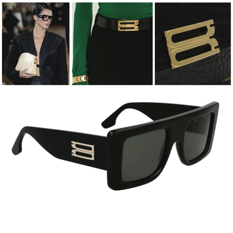 Victoria Beckham - The buckle logo displayed on model Kendall Jenner, a black belt, black bag, and black sunglasses