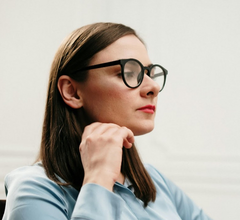 Female showing where glasses should sit on your nose