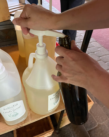 refilling wine bottle with KnoxFill soap