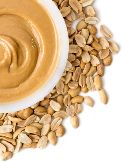 A bowl of peanut butter and peanuts