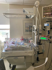 two preemie babies in nicu incubator