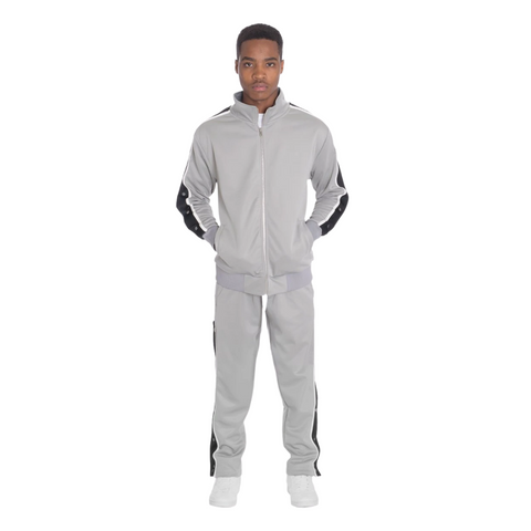 A black person wears a grey jump suit