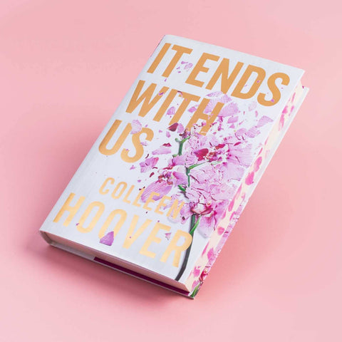 It Ends with Us hardback book angled against a pink background