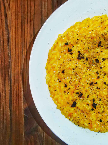 risotto con polvere di capperi e datterino giallo