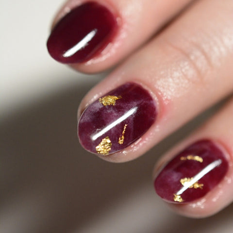 Dark Red Marble Design with Gold Elements