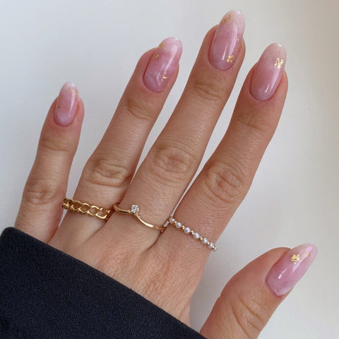 Rosy Marble Nail Design with Gold Accents