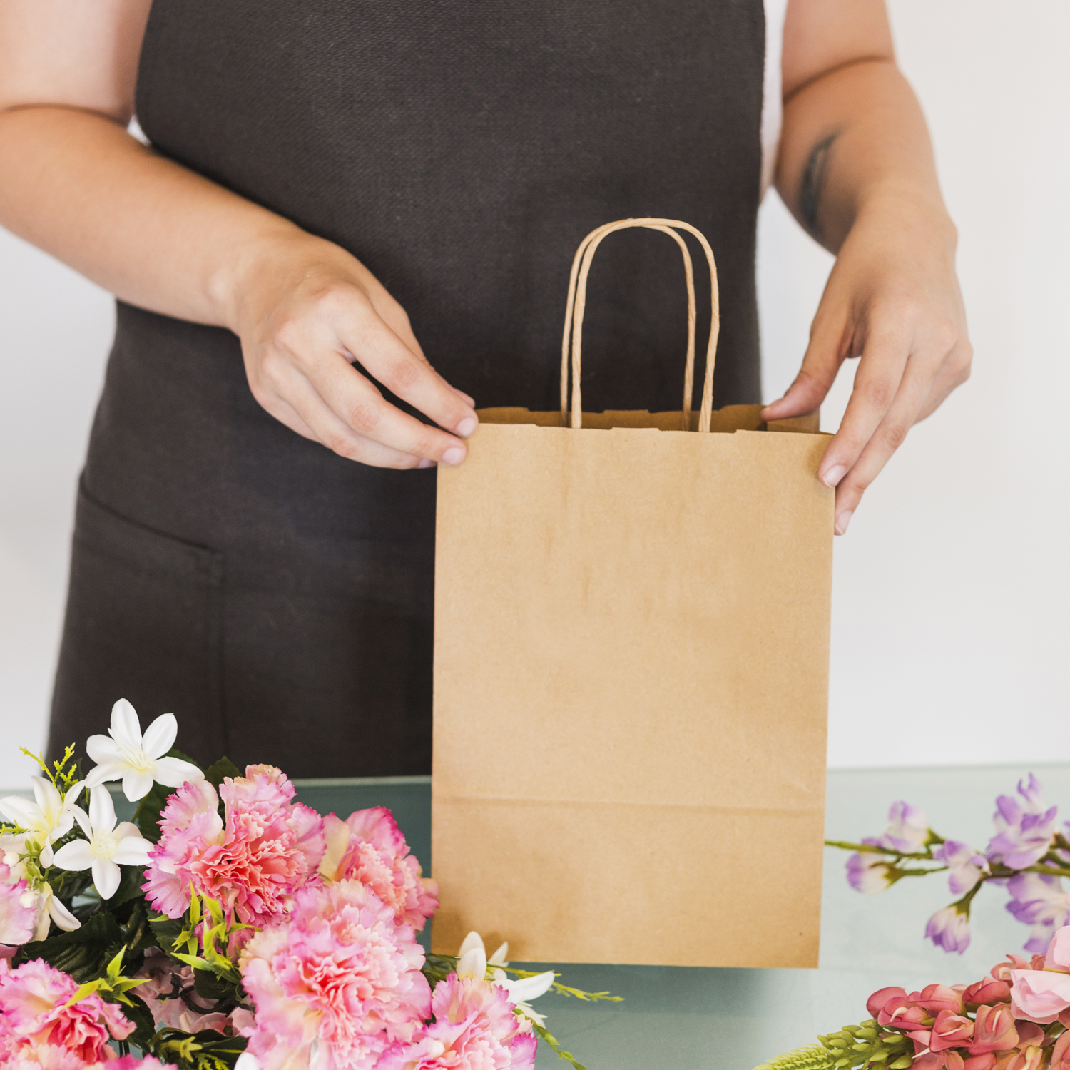 brown paper bag with handles used for flowers