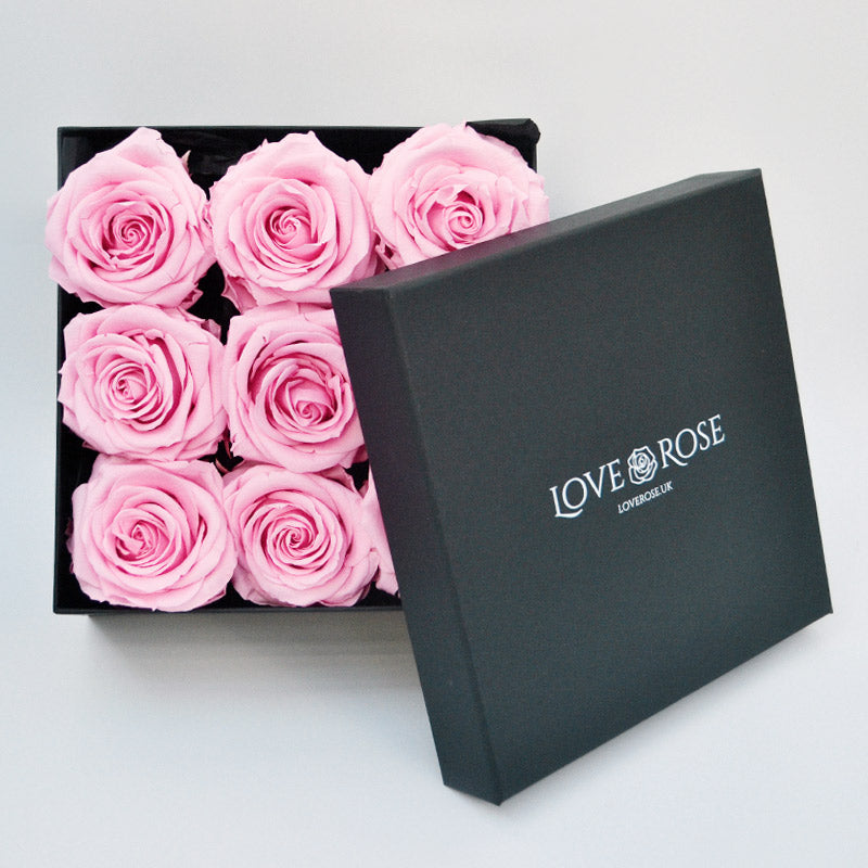 box of pink roses