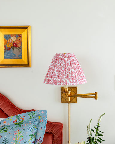 Elliston House Meadow Multi House Blue fabric on Standard Shams with a fabric lampshade gathered in Dover Poppy.