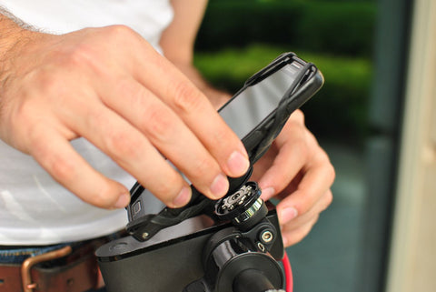 Man mount a phone holder to bike