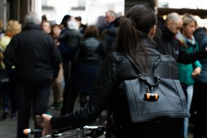 Girl with WingLights 360 Mag attached to her backpack | CYCL