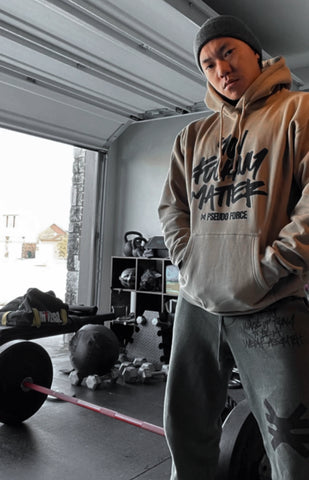 Mental health You F Matter hoodie on Kai Schafroth in his grage gym