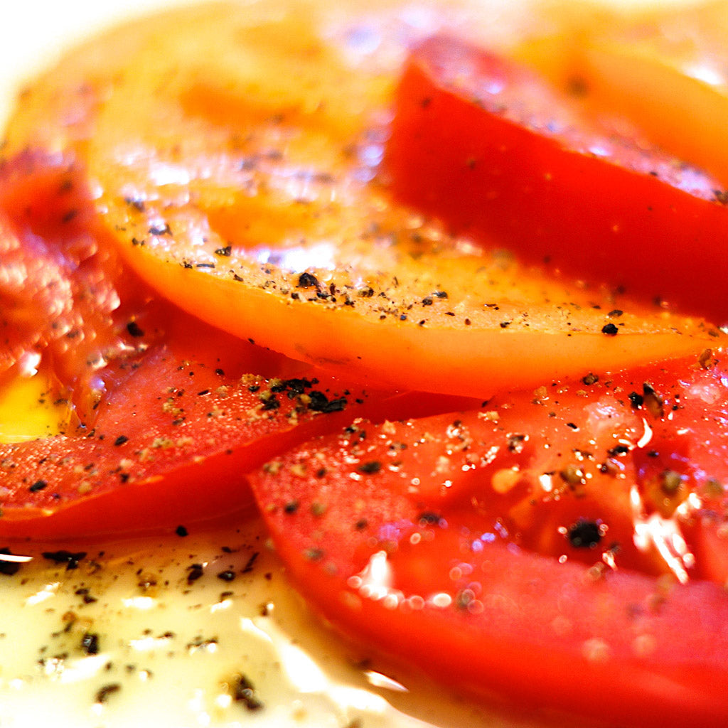 Farmer's market tomatoes sprinkled with Reluctant Trading Tellicherry Pepper, Icelandic Sea Salt and EVOO. Yum!