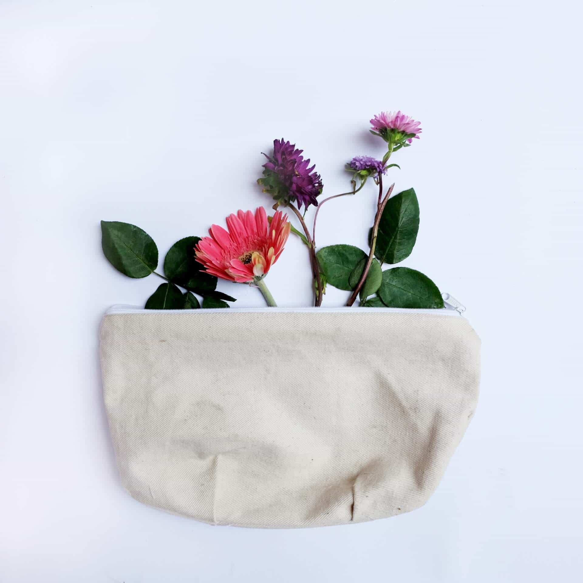 A makeup bag with a floral arrangement