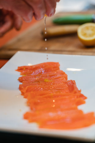 King Salmon Carpaccio adding lemon juice