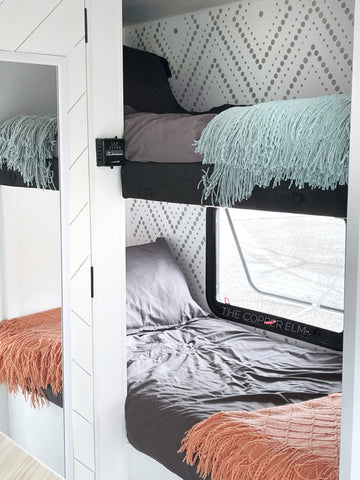 Camper bunk beds renovated in bright white walls with Cutting Edge Stencil designs painted in gray