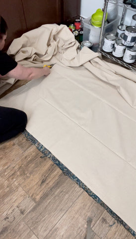 Cutting canvas drop cloth for DIY rug